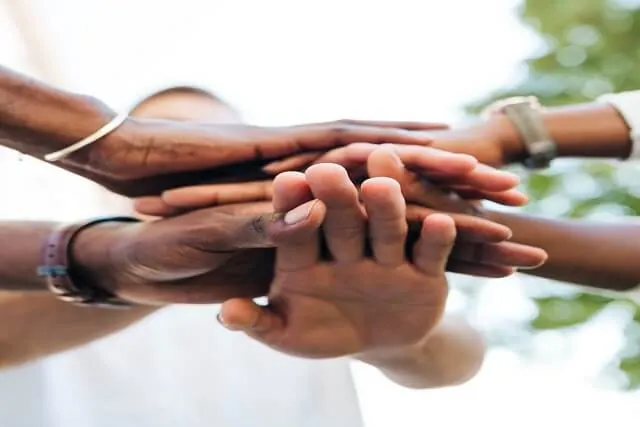 Hands joined together in support